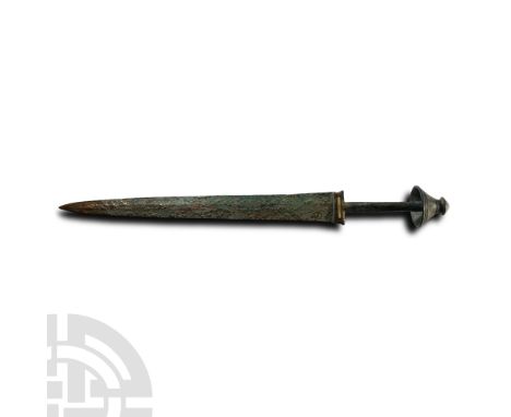 Late 2nd millennium B.C. With solid cast hilt, straight horizontal guard with turquoise inlay; plain narrow grip with conical