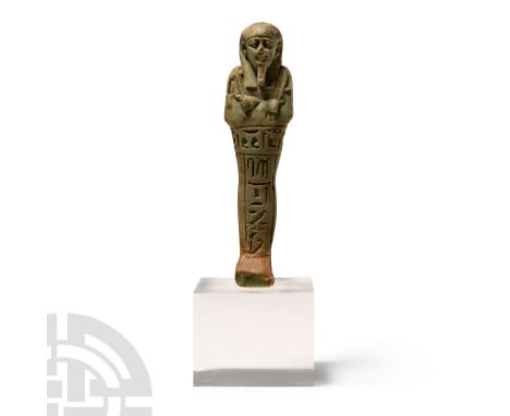 Late Period, 664-332 B.C. Olive-green glazed composition with detailed facial features, hands, tools, seed bag, dorsal pillar