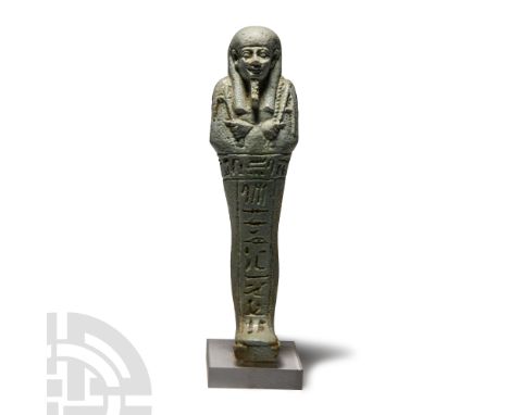 Late Period, 664-525 B.C. Finely modelled face with false beard and tripartite wig; hands holding the pick and the hoe; a see