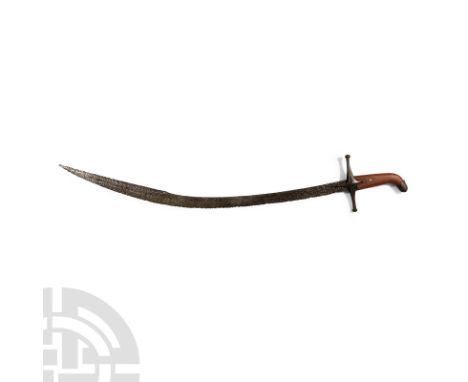 17th century A.D. Single-edged cutting blade, comprising a cross-shaped hand guard, the blade with a wide curvature widening 