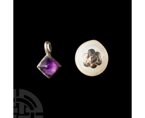 Circa 16th century A.D. Comprising: an oblate glass bead with hexafoil and loop, and a bronze pyramidal dangle.  1.64 grams t