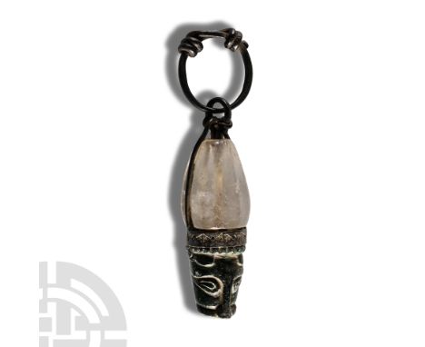Circa 10th century A.D. With fusiform hexagonal-section crystal bead modified for use as a pendant with the addition of a bro