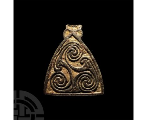 Early 9th century A.D. Triangular mount with applied rim forming a cell and interlocking La Tène spirals to the face; hook to
