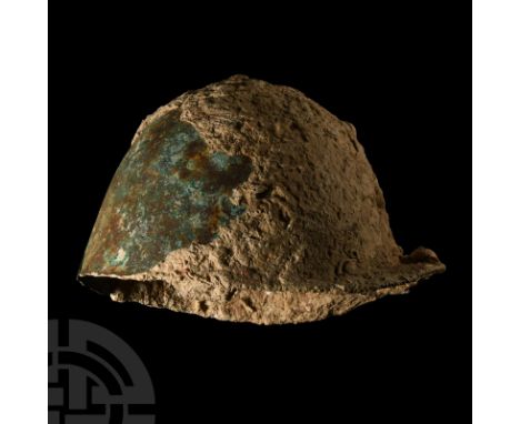 1st century B.C. Montefortino helmet with bulbous domed skull and a plain crest knob with flattened top; plain and flat neck 