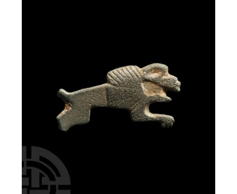 Circa 2nd century A.D. Plate brooch formed as a leaping lion with hatched mane; pin-lugs and catch to the reverse. Cf. Hattat