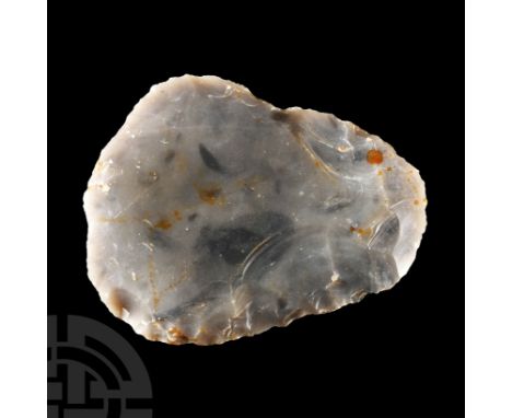 Neolithic Period, circa 6th-4th millennium B.C. Rounded scraper of biconvex profile with broad butt and scooped working edge.