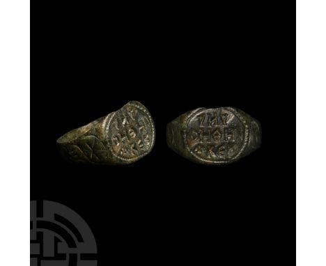 Circa 7th century A.D. With flat-section expanding hoop, scrolls and leaf motifs to shoulders; oval bezel with three lines of