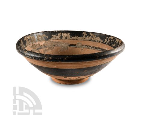 Circa 5th-3rd century B.C. With a broad, conical body and basal ring; black concentric rings to the body.  745 grams, 21.5 cm