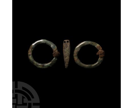 6th-9th century A.D. A mixed group of artefacts comprising: two annular brooch frames with worn remains of geometric motif an