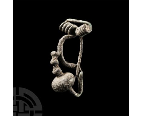 Circa 6th-3rd century B.C. Small Iberian type with broad coiled spring, lateral flange for the catch, bulbous extension to th