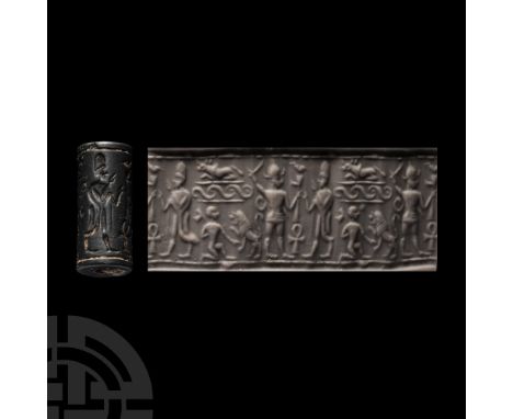 Circa 2nd millennium B.C. With detailed frieze including a standing figure with tall helmet, raising his arm to strike a simi