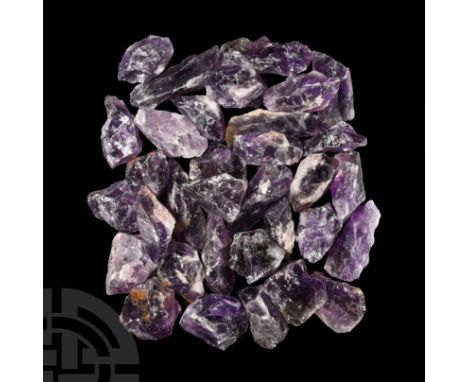 Comprising large irregular chunks in light to dark purple colour.  2.26 kg total, 42-93 mm (1 5/8 - 3 5/8 in.).From Brazil. E
