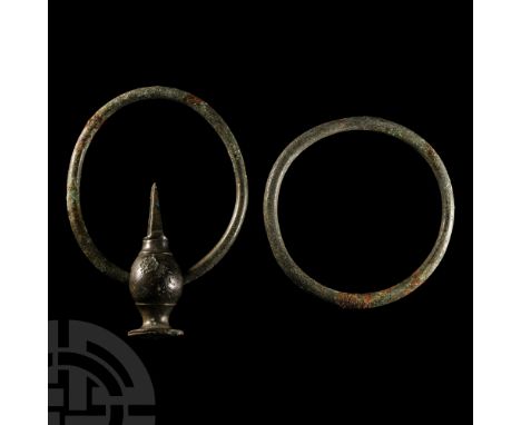 3rd-1st century B.C. Comprising two rings, one with an attachment bar with bulbous body, rectangular bar with attachment hole