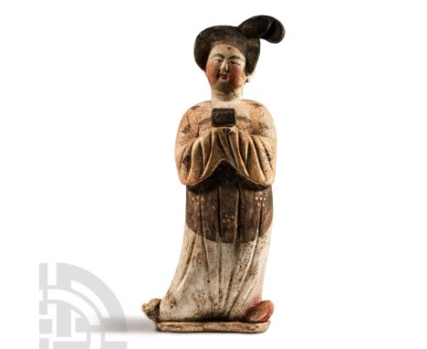 Tang Dynasty, 618-907 A.D. Modelled standing facing in a floor-length courtly dress featuring a hand fan and floral print; ha