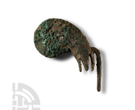 2nd-1st millennium B.C. Egg-shaped with spiked sleeves or prongs, the top of the weapon with narrow edge, the sleeves with sm