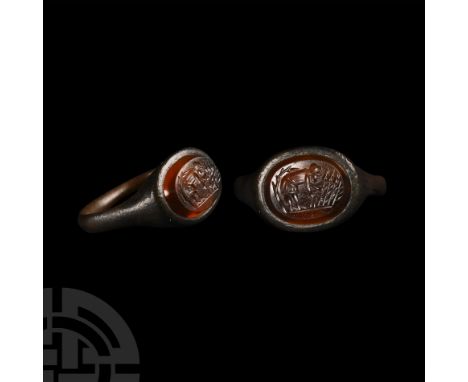 Circa 5th-6th century A.D. With narrow shank and carinated ellipsoid bezel, inset carnelian intaglio of an agricola farm-work