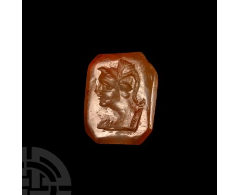 19th century A.D. Sub-rectangular in form, intaglio image of a youthful soldier wearing a high-crested helmet.  2.64 grams, 1