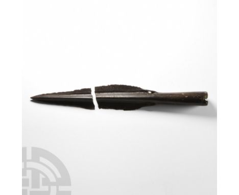 Circa 1400-1125 B.C. Leaf-shaped with loops incorporated into the base, the blade in two pieces, the centre of the blade divi