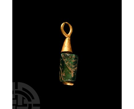 1st-4th century A.D. With an emerald green cylindrical bead, conical gold collar beneath the suspension loop.  0.38 grams, 14