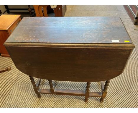 1930s oak drop flap gate leg table; raised on turned supports 