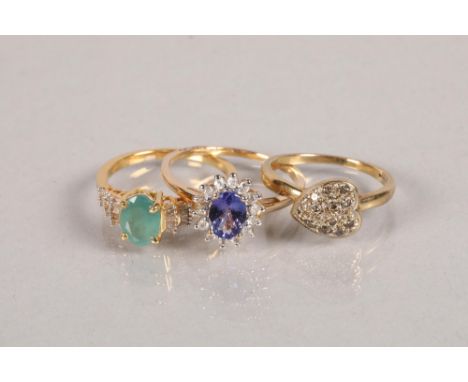 Two 9 carat yellow gold gem set rings; together with silver ring; 7.1g 