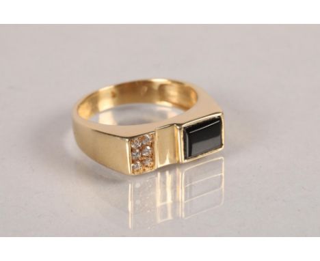 14 carat yellow gold and black hardstone set ring; 6g 