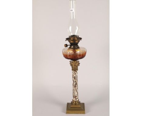Victorian mottled column oil lamp raised on stepped brass base 