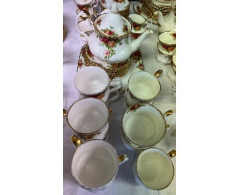 Twenty two pieces of Royal Albert Country Roses teawares to include cups; saucers; sandwich plate etc 