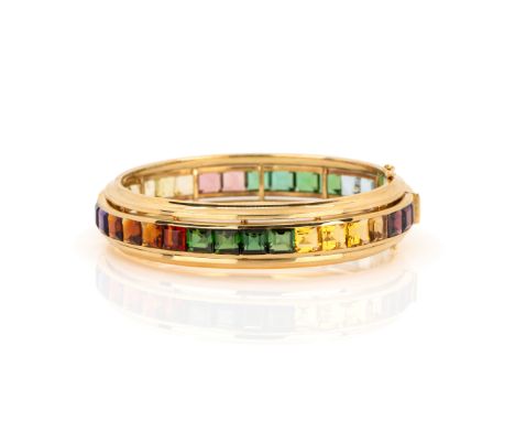 Armreif mit EdelsteinbesatzJuwelier Vitzthum, München, 750 Gelbgold, punziert, Aquamarine, Amethyste, Citrine, Turmaline und 