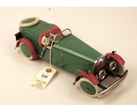 A rare 1930's No.2 Meccano Constructor Car. A round tail example in green with red mudguards, red seat, green wheels with whi