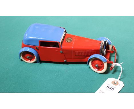 A scarce 1930's No.1 Meccano Constructor Car. An example in red with blue roof and mudguards. Red wheels with cracked white t