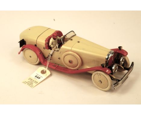 A rare 1930's No.2 Meccano Constructor Car. A round tail example in cream with red mudguards and running boards, red seat, cr