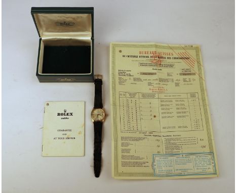 A Rolex  Oyster perpetual date, in 18ct gold. Hall marked to the rear of the case. Used condition, with scratches to the glas