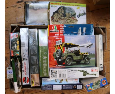 65+ Various scales  model kits comprising of military related vehicles, tanks, artillery, jeeps, motorcycles, buses, trucks e