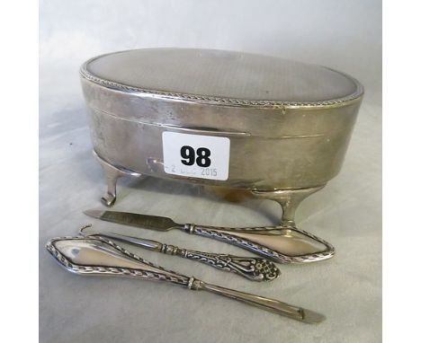 An oval silver jewellery casket and nail tools, Birmingham 1918, 6 long
