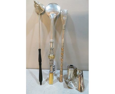 A silver table lighter in the form of a 35mm roll of film A/F, a Gorham silver candle snuffer and two white metal iced tea st