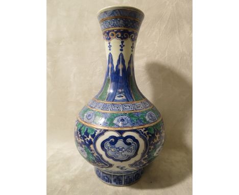 A late 19th century/early 20th century Chinese vase decorated with dragons, Greek key and styalized floral designs, underglaz
