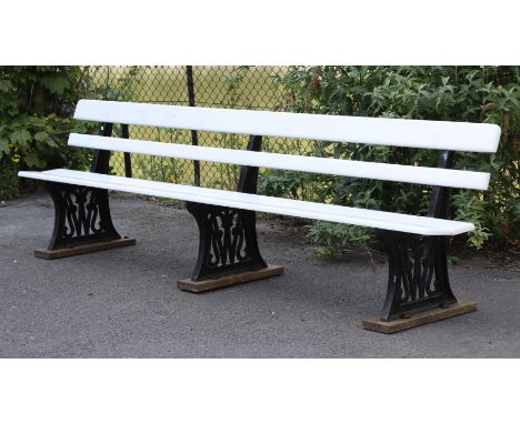 A VINTAGE GREAT WESTERN RAILWAYS PLATFORM BENCH with white painted wooden slatted seat &amp;back, &amp; in three black painte