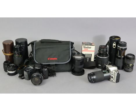 A Minolta “Dynax 5xi” camera; a ditto “Dynax 500si” camera, each with lens, &amp; case; together with six various other lense