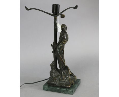 A reproduction bronzed cast-metal female figural table lamp after Emmanuel Villanis titled: “The Hostage”, mounted on a green