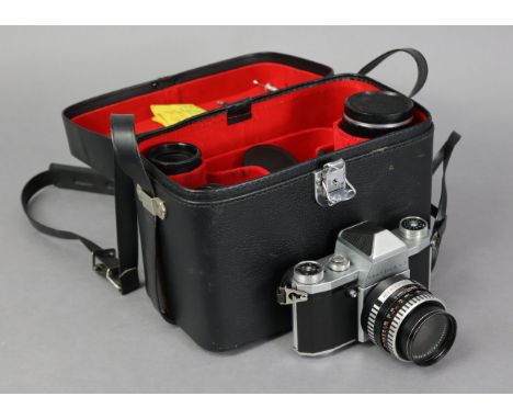 A Praktica “VF” camera, with four lenses, &amp; various other accessories, with case. 