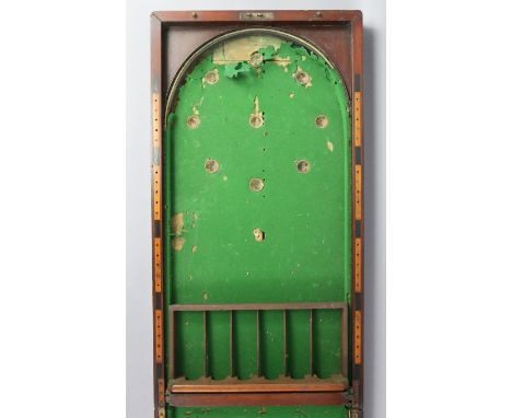 An early 20th century mahogany folding billiards/bagatelle table 60” x 15¾” (w.a.f.).