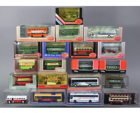 Twenty various scale model buses, each with window box.