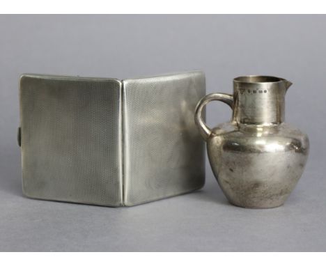 A late Victorian silver cream jug of globular form, 3” high, Birmingham 1888; &amp; a George V silver engine-turned cigarette