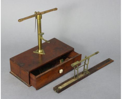 An early 20th century brass portable beam scale, fitted long drawer to the mahogany box base; &amp; another brass portable sc