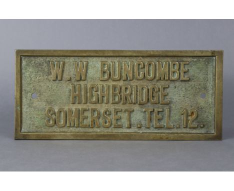 A steam roller brass owner’s plaque inscribed: “W. W. BUNCOME HIGHBRIDGE SOMERSET. TEL 12”; size: 6” x 13¾”.