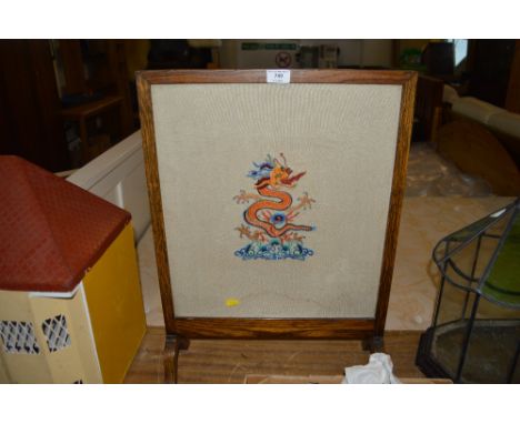An oak and embroidered firescreen