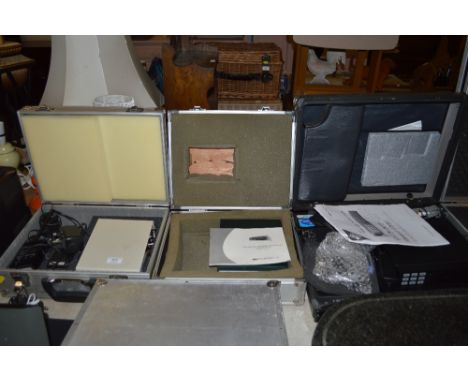 An REC digital video recorder; a Quadra hard disk caddy and a frequencey counter, all in fitted cases