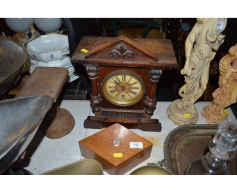 A wooden trinket box inset with a white stone and a late Victorian single hole mantel clock