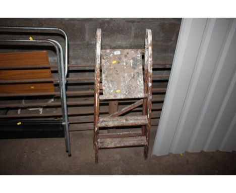 A small wooden step ladder 